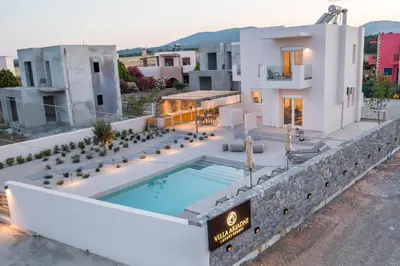 a villa with a swimming pool on top of a building at Villa Ariadne in Gennadi