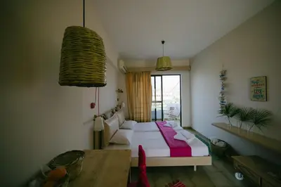a room with a bed and a table in it at Gorgona Studios in Faliraki