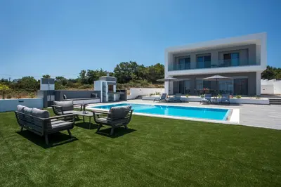 a villa with a swimming pool and lawnitures at Melilia luxury villa in Gennadi