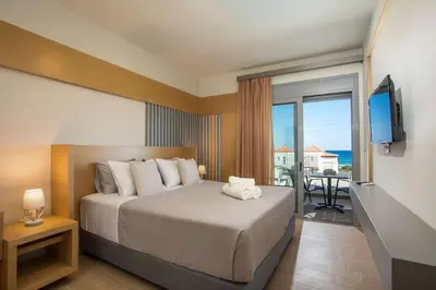 a bedroom with a bed with a view of the ocean at Melilia luxury villa in Gennadi