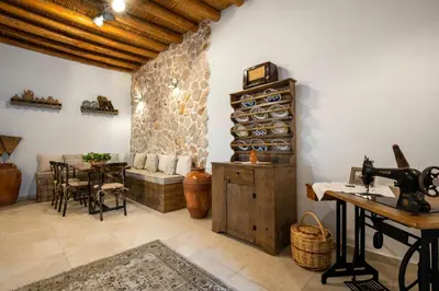 a room with a table and a dining room at Mareò Traditional Retreat in Archangelos