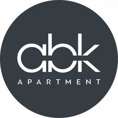 a logo for an apartment building with the initials h x at abk apartment in Afantou