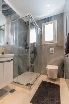 a bathroom with a shower and a toilet at Perfect Living in Rhodes Town