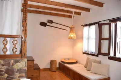 a living room with a couch and a fireplace at MOM'S RETREAT in Siána