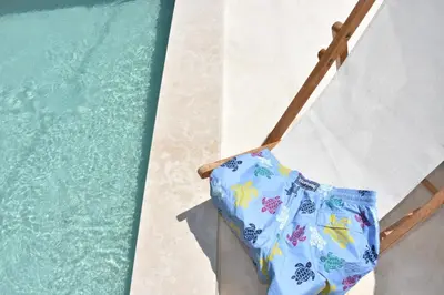 a towel on a towel rack next to a swimming pool at MOM'S RETREAT in Siána