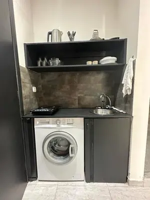 a kitchen with a washing machine and a sink at JZ Boutique 2 in Rhodes Town