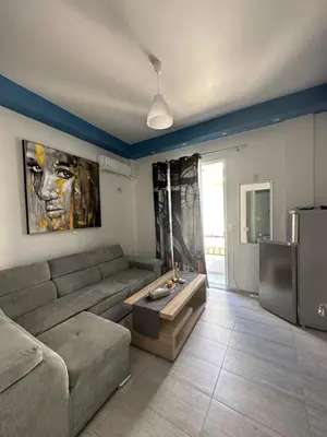 a living room with a couch and a table at JZ Boutique 2 in Rhodes Town
