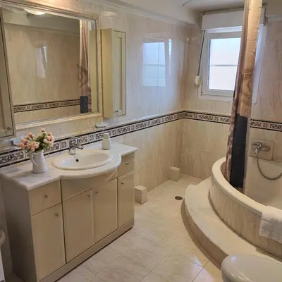 a bathroom with a sink and a shower and a tub at Aithrea's HOMES in Pastida Rhodes in Pastida