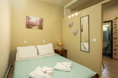 a bedroom with a bed with towels on it at Irinis studio in Rhodes Town