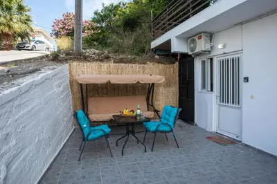 a table and two chairs on a patio at Irinis studio in Rhodes Town