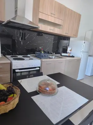 a kitchen with a table with a bowl on the counter at Aelia studio in Symi