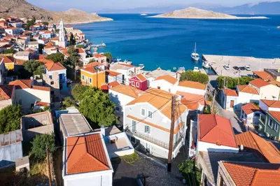 an aerial view of a town with houses and the ocean at FOURLANOU HOUSE in Halki