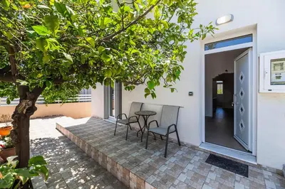 a patio with two chairs and a table at Kira's House Rhodes Town in Rhodes Town