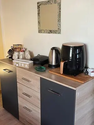 a coffee maker sitting on top of a wooden counter at Foteini’s House in Symi
