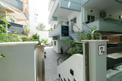 an external view of a building with a door and stairs at Rhodes Retreat: Modern Comfort in Serene Luxury in Rhodes Town