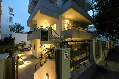 a building with lights on the side of it at Rhodes Retreat: Modern Comfort in Serene Luxury in Rhodes Town