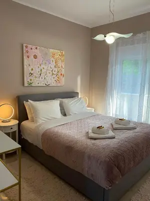 a bedroom with a bed with two towels on it at Thalia's House in Pastida
