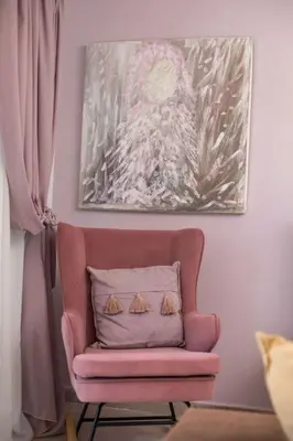 a pink chair with a pillow in a room at Thalia's House in Pastida