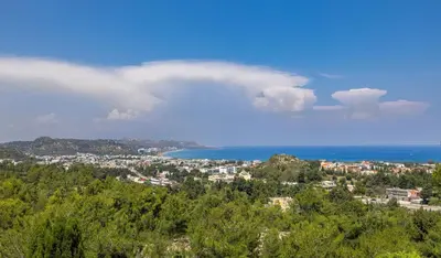 a view of a city and the ocean from a hill at Aegean View Estate - Villa in Faliraki