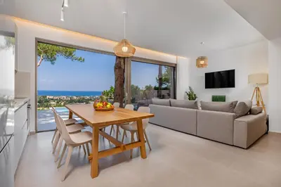 a living room with a table and a couch at Aegean View Estate - Villa in Faliraki