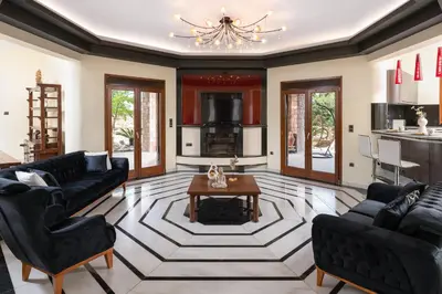 a living room with couches and a table at Glamorous Villa Nefeli in Koskinou