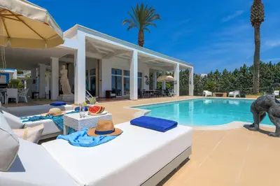 a villa with a swimming pool and a patio at Grande Dame Villa of Rhodes in Rhodes Town
