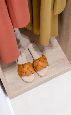 a pair of flip flops and a pair of sandals at VillaBlu Apartments in Asgourou