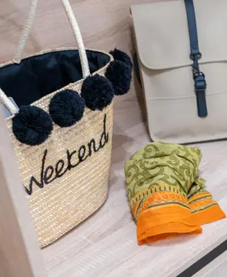 a diaper bag and a towel in a box at VillaBlu Apartments in Asgourou