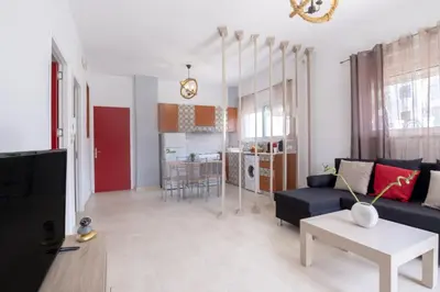 a living room with a couch and a table at VillaBlu Apartments in Asgourou