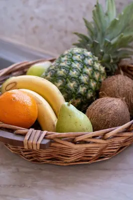 a basket filled with fruit on a table at VillaBlu Apartments in Asgourou