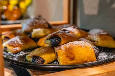 a tray of pastries sitting on a table at Astron Hotel Rhodes in Rhodes Town