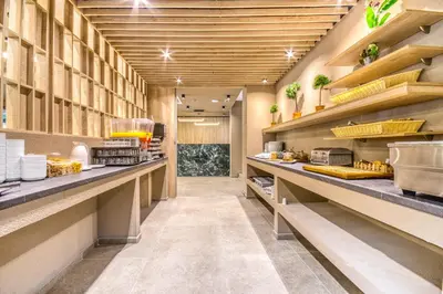 a large kitchen with long counters in a restaurant at Astron Hotel Rhodes in Rhodes Town