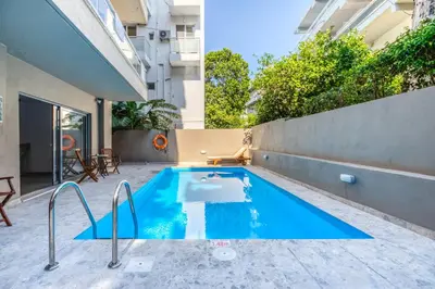a swimming pool in the backyard of a building at Astron Hotel Rhodes in Rhodes Town