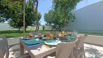 a table with plates of food on top of it at Dimitra - Kattavia surf houses in Kattavía