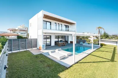 a large white house with a pool at D&R Boutique Villas R in Gennadi