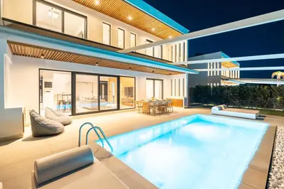 a house with a swimming pool in the backyard at D&R Boutique Villas D in Gennadi