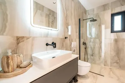 a bathroom with a sink and a toilet at D&R Boutique Villas D in Gennadi
