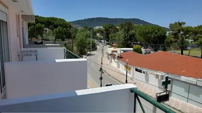 a view of a city street from a balcony at orange in Ialyssos
