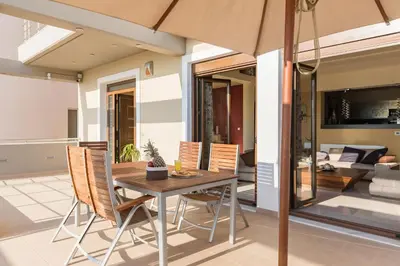 a dining room with a table and chairs at Halide Luxury Villa in Ixia