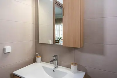 a bathroom with a sink and a mirror at Extreme House in Archangelos