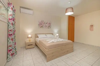 a bedroom with a bed in a room at Panormos Luxury House in Rhodes Town