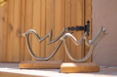 a pair of metal sculptures sitting on top of a table at Panormos Luxury House in Rhodes Town
