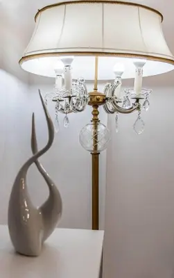 a lamp with a metal animal statue on a table at Nikolias dream house in Ialyssos