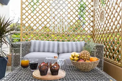 a table with a bowl of fruit on a patio at Nikolias dream house in Ialyssos
