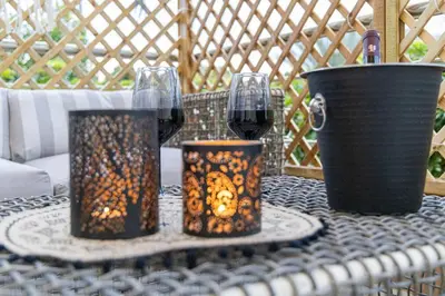 a table with two glasses of wine on top of it at Nikolias dream house in Ialyssos