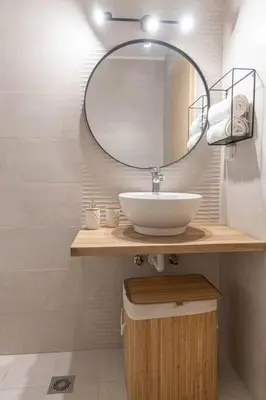 a bathroom with a sink and a mirror at Nikolias dream house in Ialyssos