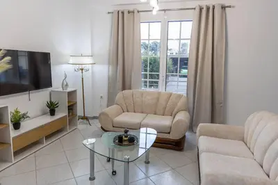 a living room with a couch and a chair and a table at Nikolias dream house in Ialyssos