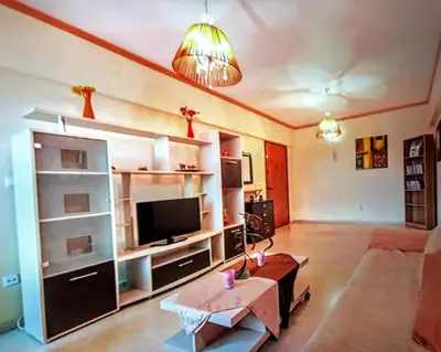 a living room with a tv and a couch at Rhodos town apartment in Rhodes Town