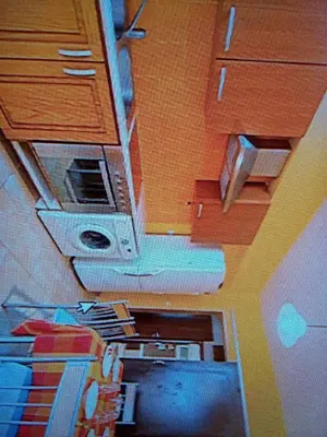 a room with a ceiling with cabinets and a monitor at Rhodos town apartment in Rhodes Town