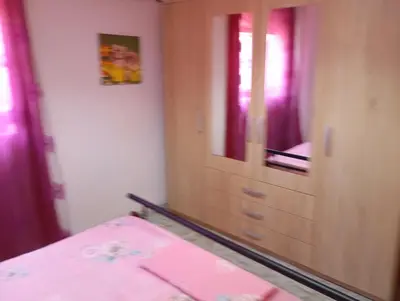 a bedroom with a dresser and a mirror at Rhodos town apartment in Rhodes Town